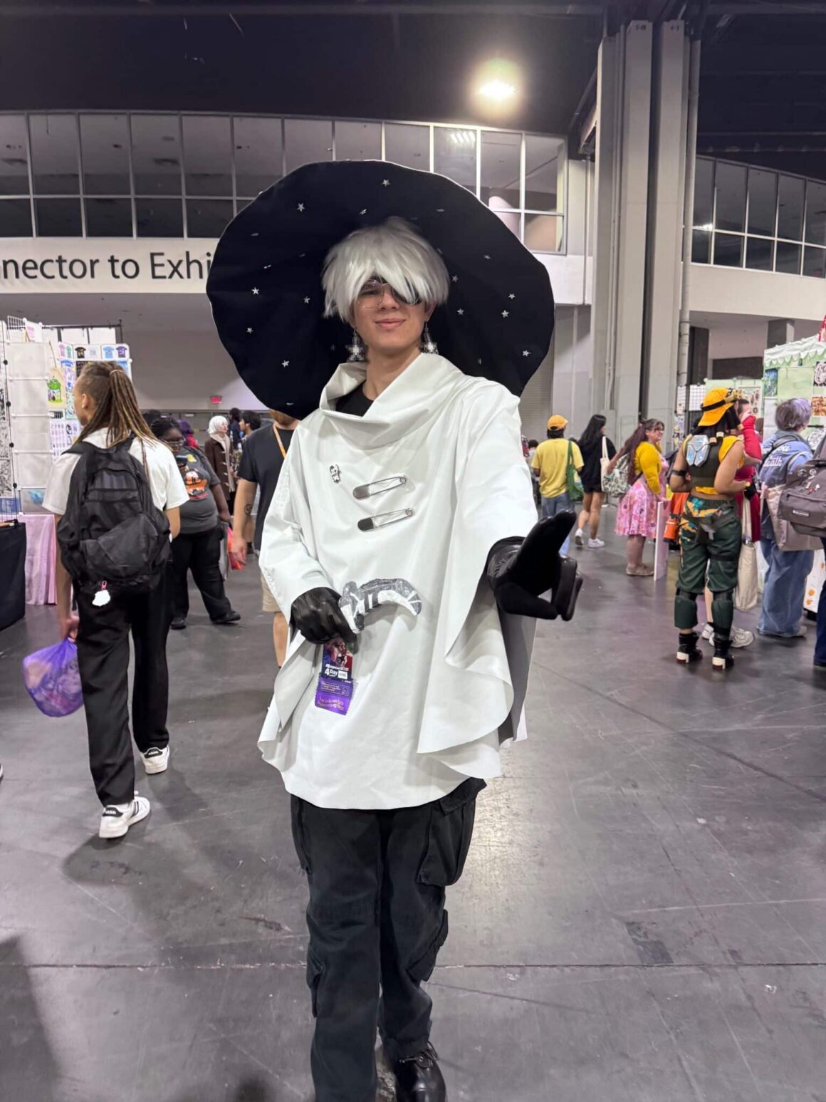 A young adult is dressed as a character from In Stars and Time at MomoCon 2025.