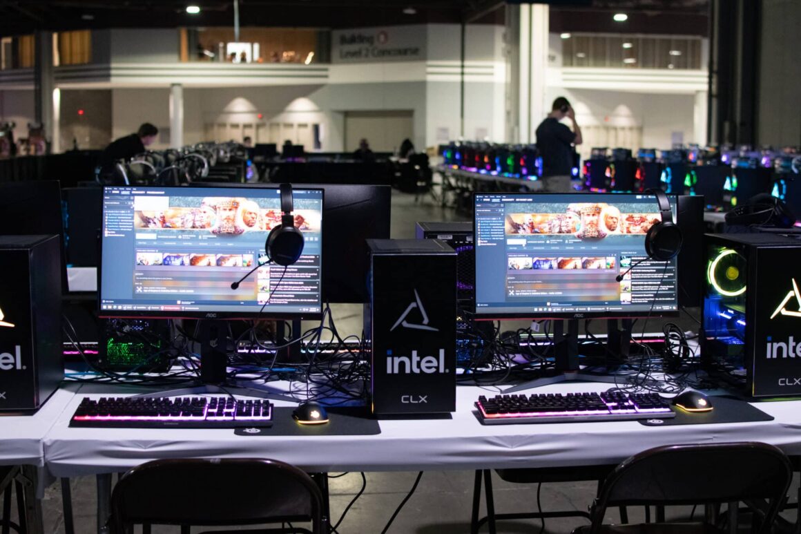 A large area of gaming computers and monitors on tables at MomoCon 2025.