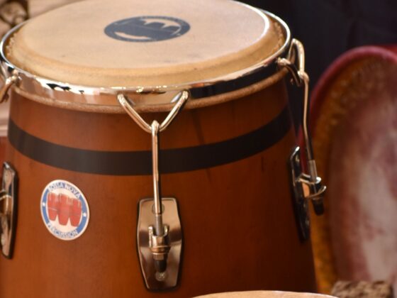 Tall drums with brown wood frames at a world music event.